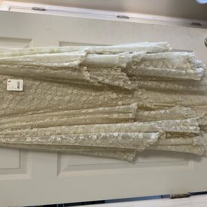 Free people skirt NWT. Ivory in color, size XL. High/low design.